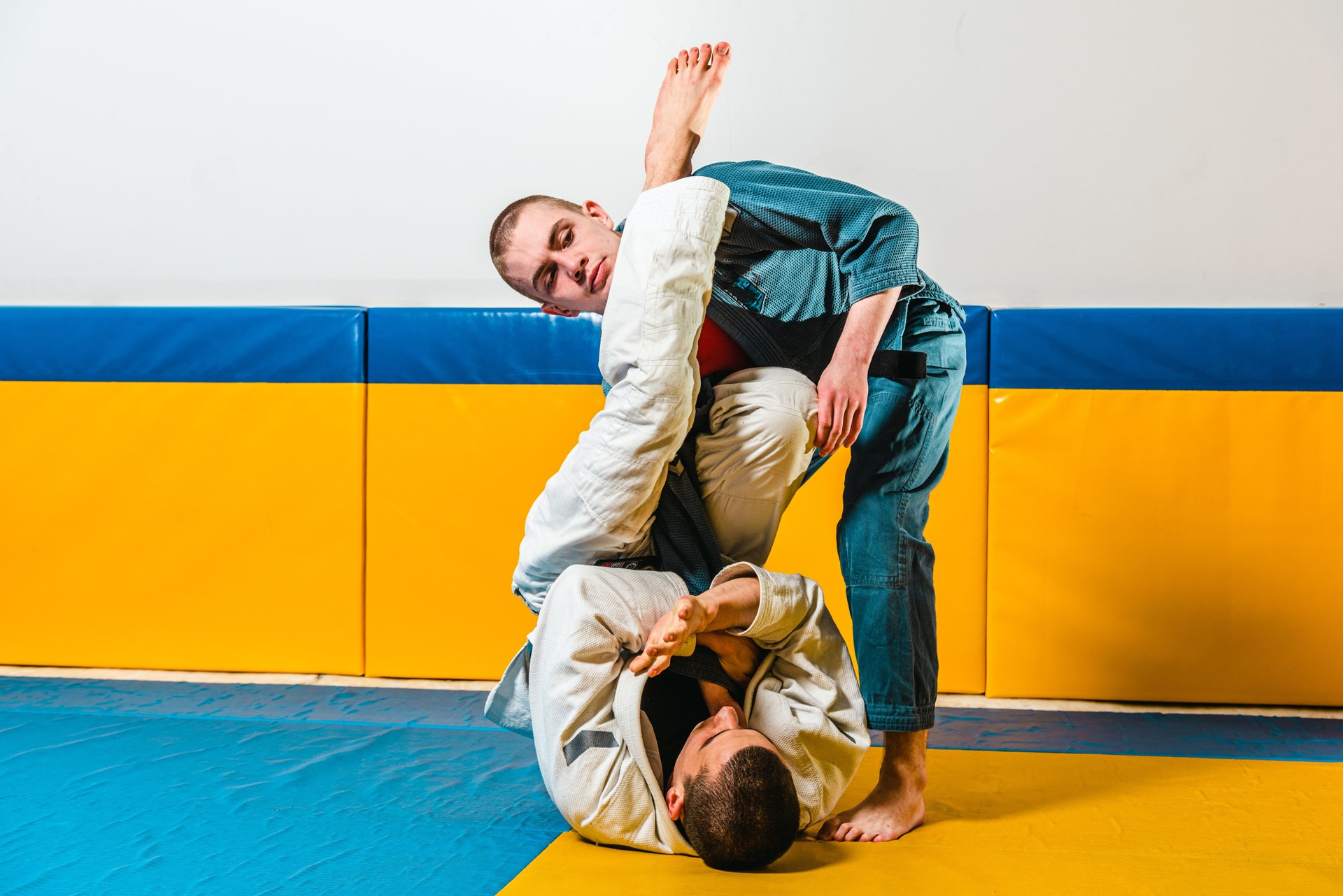 Brazilian jiu-jitsu and grappling training for men in a self-defense gym